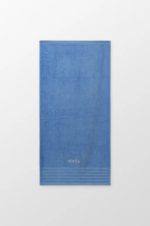 toalla de baño de color azul bordada